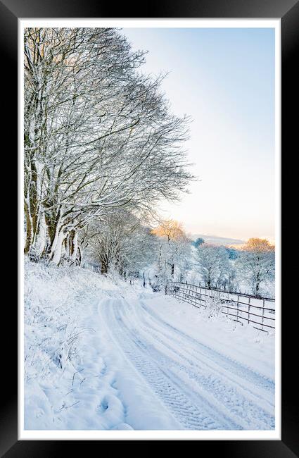 The snowy road home Framed Print by Clive Ashton