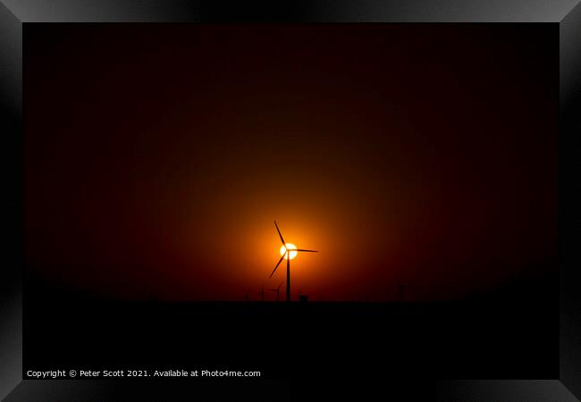 sunsetting behind Oklahoma wind farm Framed Print by Peter Scott