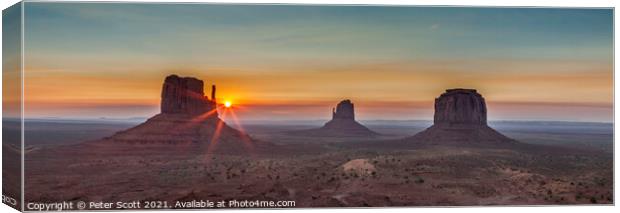 A sunrise at Monument Valley. Canvas Print by Peter Scott
