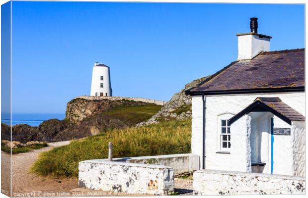 Pilot's cottage with lighthouse in the background Canvas Print by Kevin Hellon