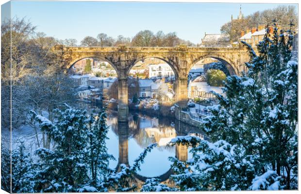 Winter snow sunrise over the railway viaduct and river Nidd in Knaresborough, North Yorkshire.  Canvas Print by mike morley