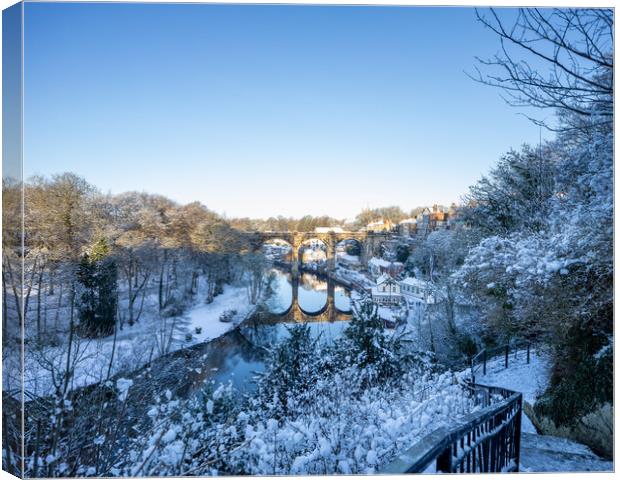 Winter snow sunrise over the railway viaduct and river Nidd in Knaresborough, North Yorkshire.  Canvas Print by mike morley