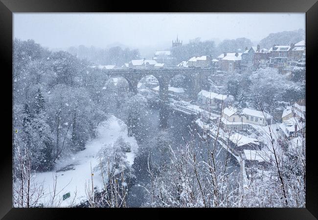 Winter snow over the river Nidd and famous landmark railway viaduct in Knaresborough, North Yorkshire. Framed Print by mike morley