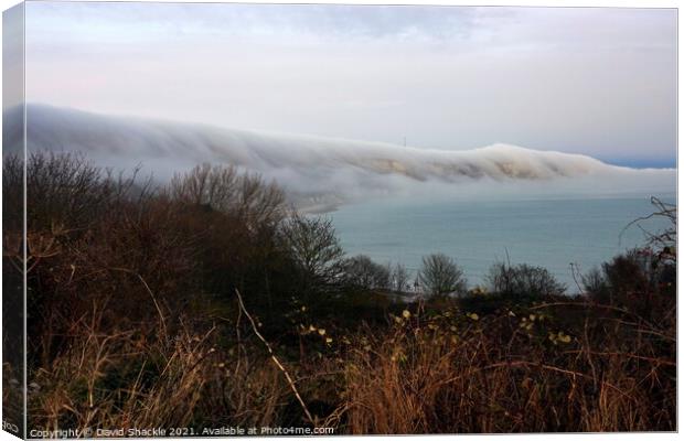Mist Clinging To Cliff Face Canvas Print by David Shackle