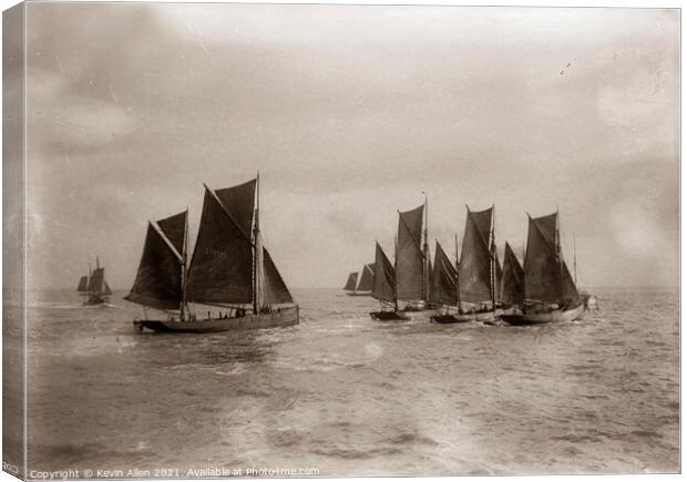 Early 1900's sailing fishing Smacks  off East Angl Canvas Print by Kevin Allen