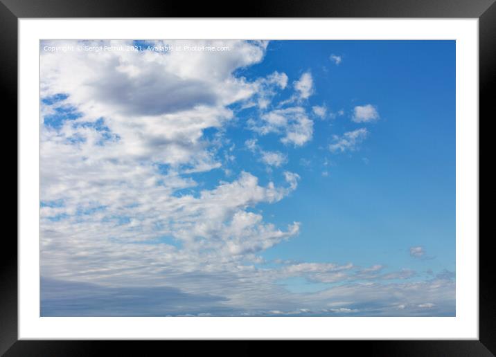 White clouds gradually leave the blue sky, dividing it into two sections Framed Mounted Print by Sergii Petruk