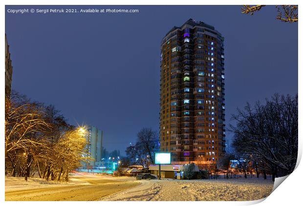 High-rise apartment building against the background of a city street in a winter city evening park covered with snow against a background of blue twilight. Print by Sergii Petruk