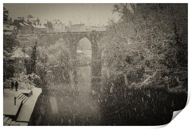 Winter snow over the river Nidd and famous landmark railway viaduct in Knaresborough, North Yorkshire Print by mike morley