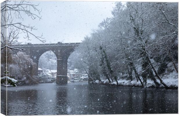 Winter snow over the river Nidd and famous landmark railway viaduct in Knaresborough, North Yorkshire Canvas Print by mike morley