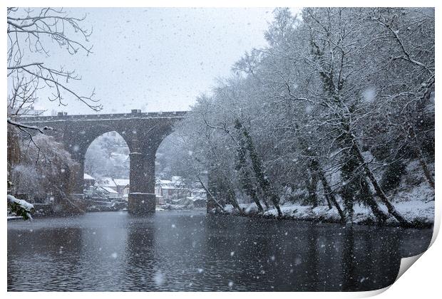 Winter snow over the river Nidd and famous landmark railway viaduct in Knaresborough, North Yorkshire Print by mike morley