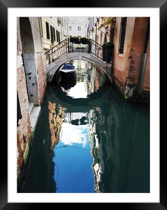 Venice, Italy : One of the small bridge on canal with reflection of building . View of bridge of sights with gondoliers boats docked under the bridge Framed Mounted Print by Arpan Bhatia