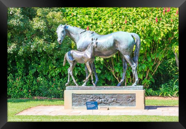 Mare and foal statue. Framed Print by Kevin Hellon