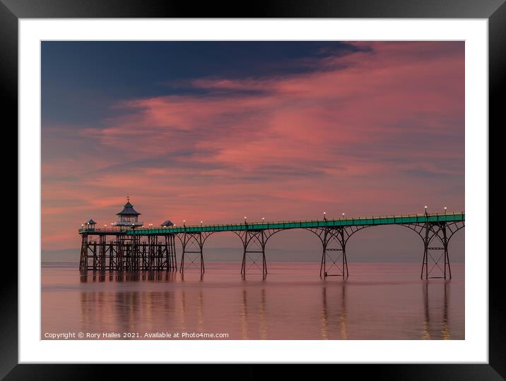 Clevedon Pier at sunset on a calm evening Framed Mounted Print by Rory Hailes