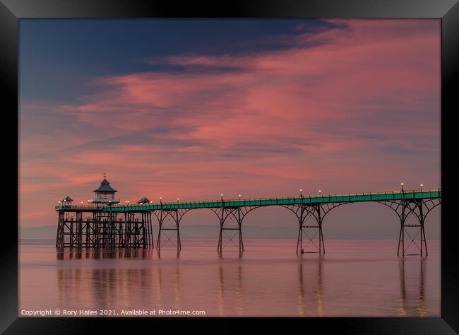 Clevedon Pier at sunset on a calm evening Framed Print by Rory Hailes