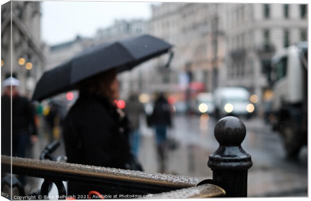 Under the umbrella Canvas Print by Sara Melhuish