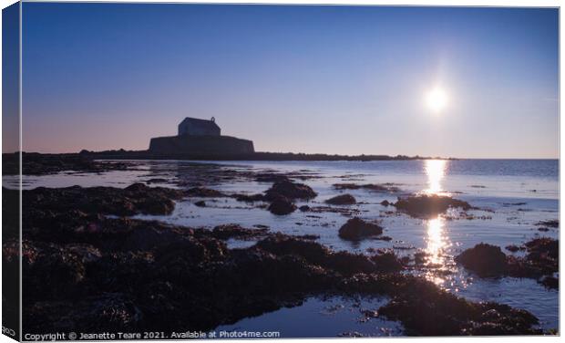 Cwyfan sunset. The chapel in the sea, off Anglesey, Wales. Canvas Print by Jeanette Teare