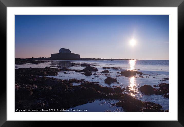 Cwyfan sunset. The chapel in the sea, off Anglesey, Wales. Framed Mounted Print by Jeanette Teare