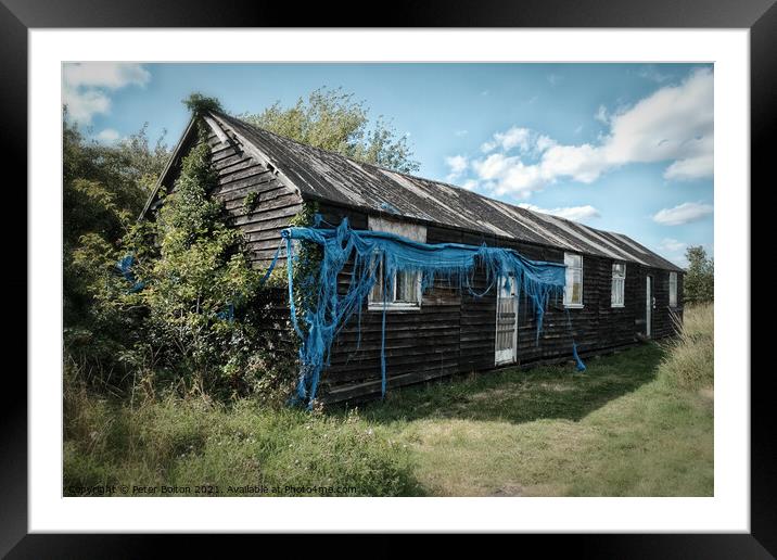 Wooden army barack hut from WWII at Bradwell on Sea, Essex, UK. Framed Mounted Print by Peter Bolton