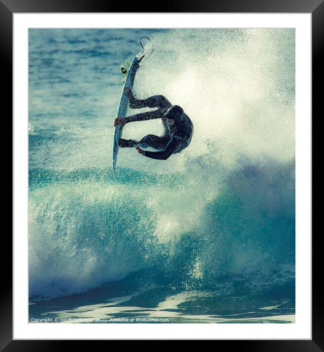 A surfer takes to the 'air' Framed Mounted Print by Geoff Tydeman