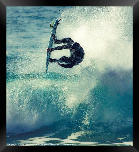 A surfer takes to the 'air' Framed Print by Geoff Tydeman