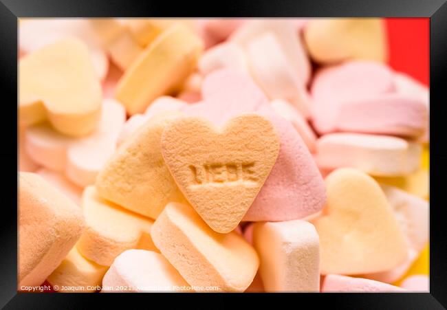 Word love written in German on a candy heart, sweet image for Va Framed Print by Joaquin Corbalan