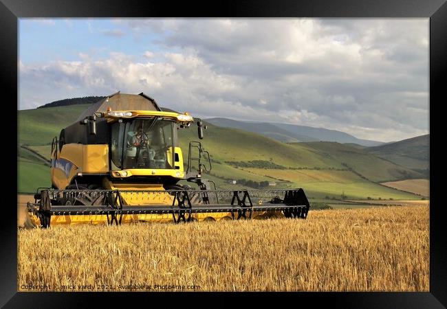 Harvesting barley in the Cheviot Hills. Framed Print by mick vardy