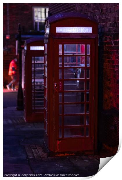 Red English Telephone boxes in a night time street Print by That Foto