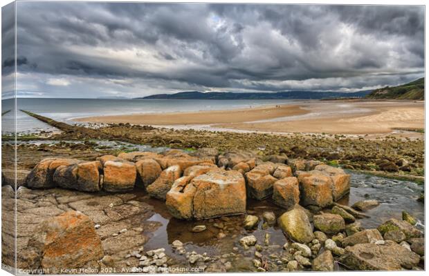 Stormy skies over Benllech Beach Canvas Print by Kevin Hellon