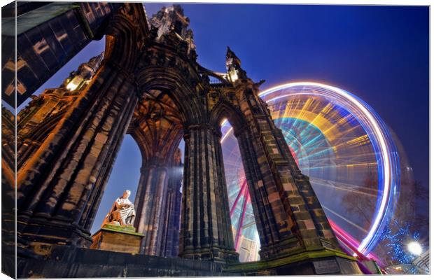 The Scott Monument in Edinburgh with Ferris wheel. Canvas Print by Andrea Obzerova