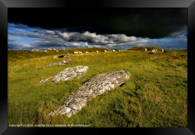Arbor Low with rain clouds moving throught Framed Print by Chris Drabble