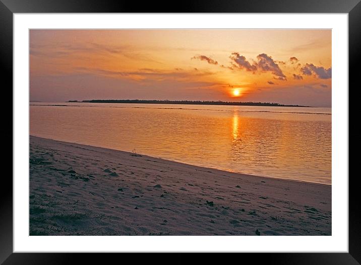 sun setting Framed Mounted Print by Hassan Najmy