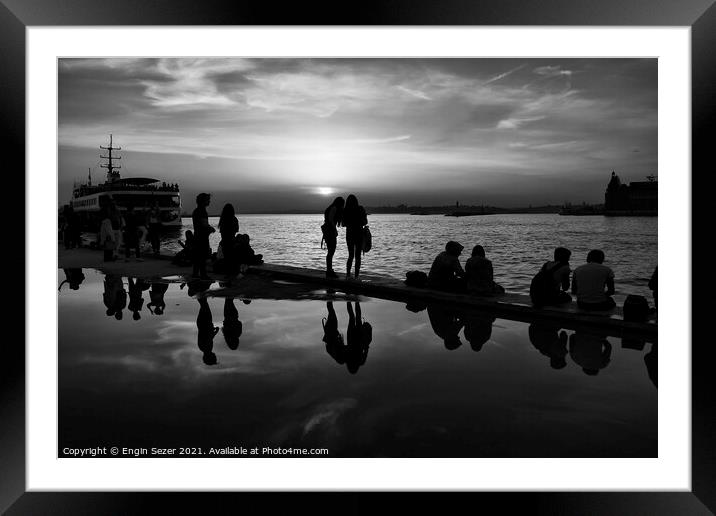 Silhouettes of some young people with beautiful re Framed Mounted Print by Engin Sezer