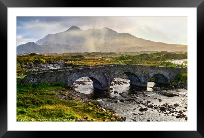 The old Bridge at Sligachan in a rain storm Framed Mounted Print by Chris Drabble