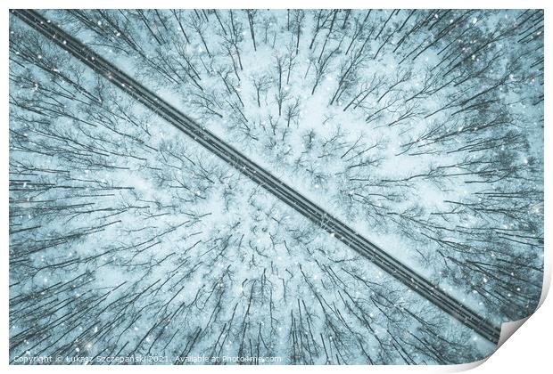 Road through winter forest Print by Łukasz Szczepański