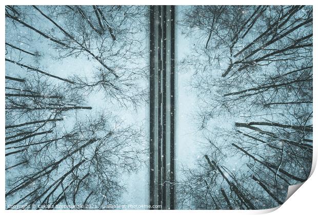 Road through winter forest Print by Łukasz Szczepański
