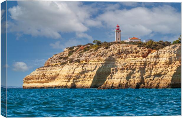 Alfanzina lighthouse on the clifftop at Carvoeiro  Canvas Print by Kevin Snelling