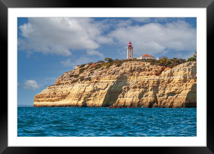 Alfanzina lighthouse on the clifftop at Carvoeiro  Framed Mounted Print by Kevin Snelling