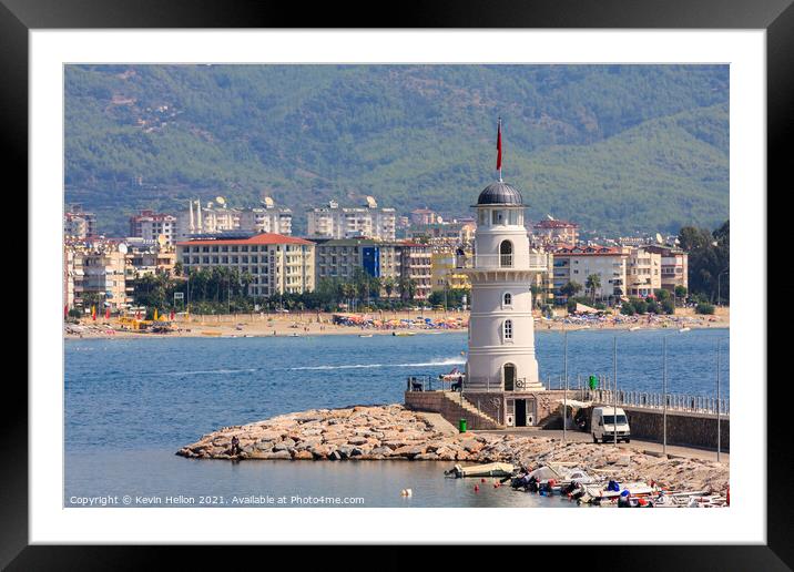 The lighthouse guarding the entrance to Alanya harbour Framed Mounted Print by Kevin Hellon