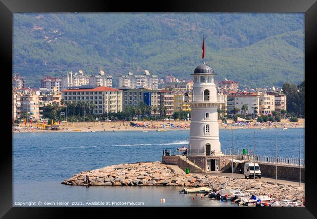 The lighthouse guarding the entrance to Alanya harbour Framed Print by Kevin Hellon