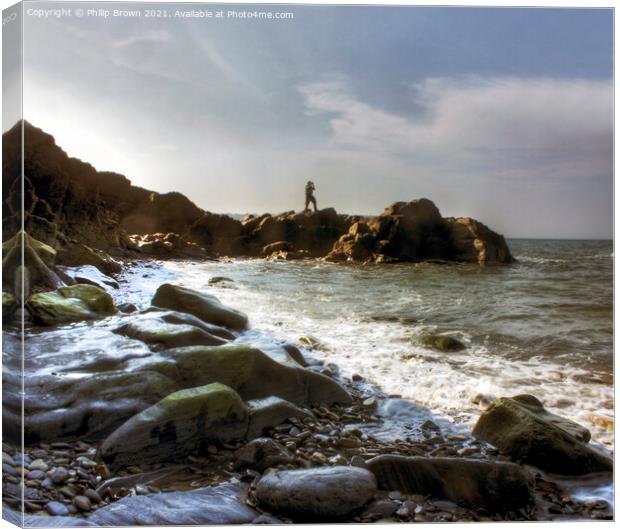 Man on the rocky shores of Tresaith, South Wales Canvas Print by Philip Brown