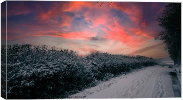 Wintery lane at sunset Canvas Print by Paul Tyzack