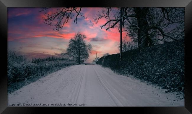 Snow covered lane at Sunset Framed Print by Paul Tyzack