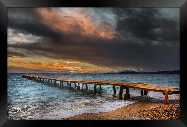 The Old wooden Jetty at Ipsos beach in Corfu at Sunrise Framed Print by Dave Williams