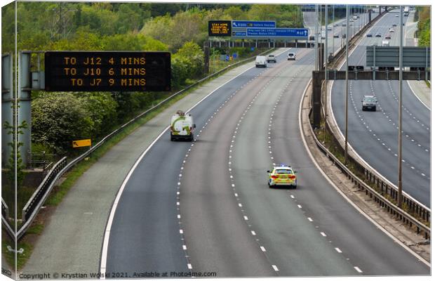 A police car responding to an emergency on the M60 motorway in UK Canvas Print by Krystian Wolski