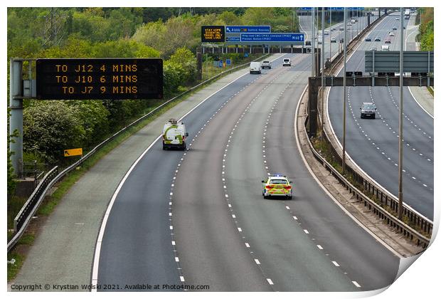 A police car responding to an emergency on the M60 motorway in UK Print by Krystian Wolski
