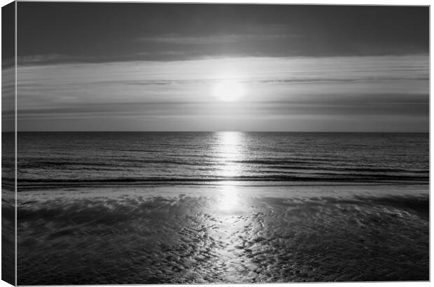 Sunrise over the sea at Frinton in timeless black  Canvas Print by Paula Tracy