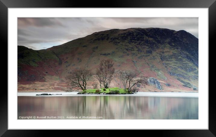 Island reflections in Crummock water  Framed Mounted Print by Russell Burton
