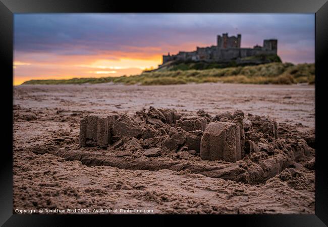 Bamburgh Castle in Sand Framed Print by Jonathan Bird