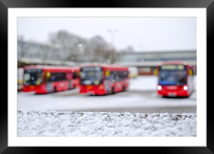 A trio of London buses in the snow Framed Mounted Print by Sara Melhuish