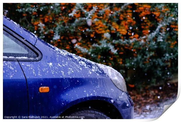 A blue car in the snow Print by Sara Melhuish